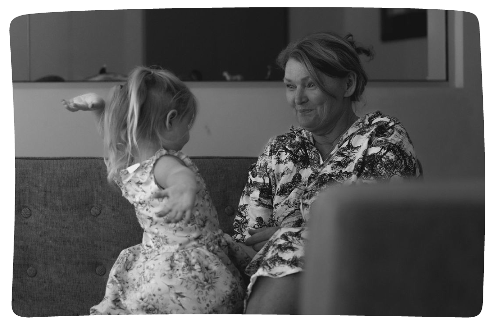 Grandmother and granddaughter sitting together
